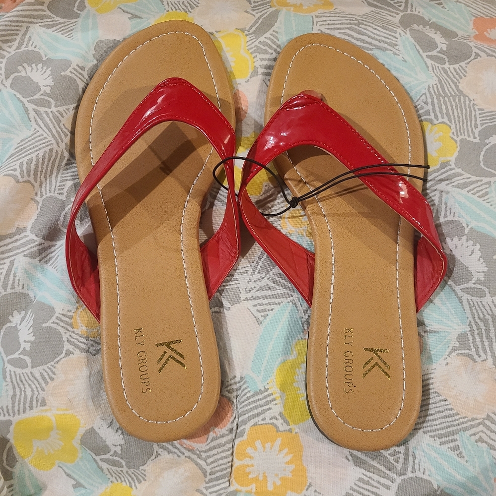 NWOT Red Kly Group Flip Flops